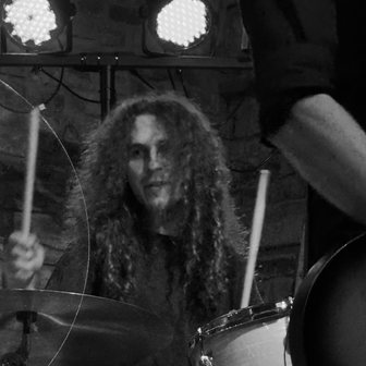 Nikolai Schlott smiling at the drums